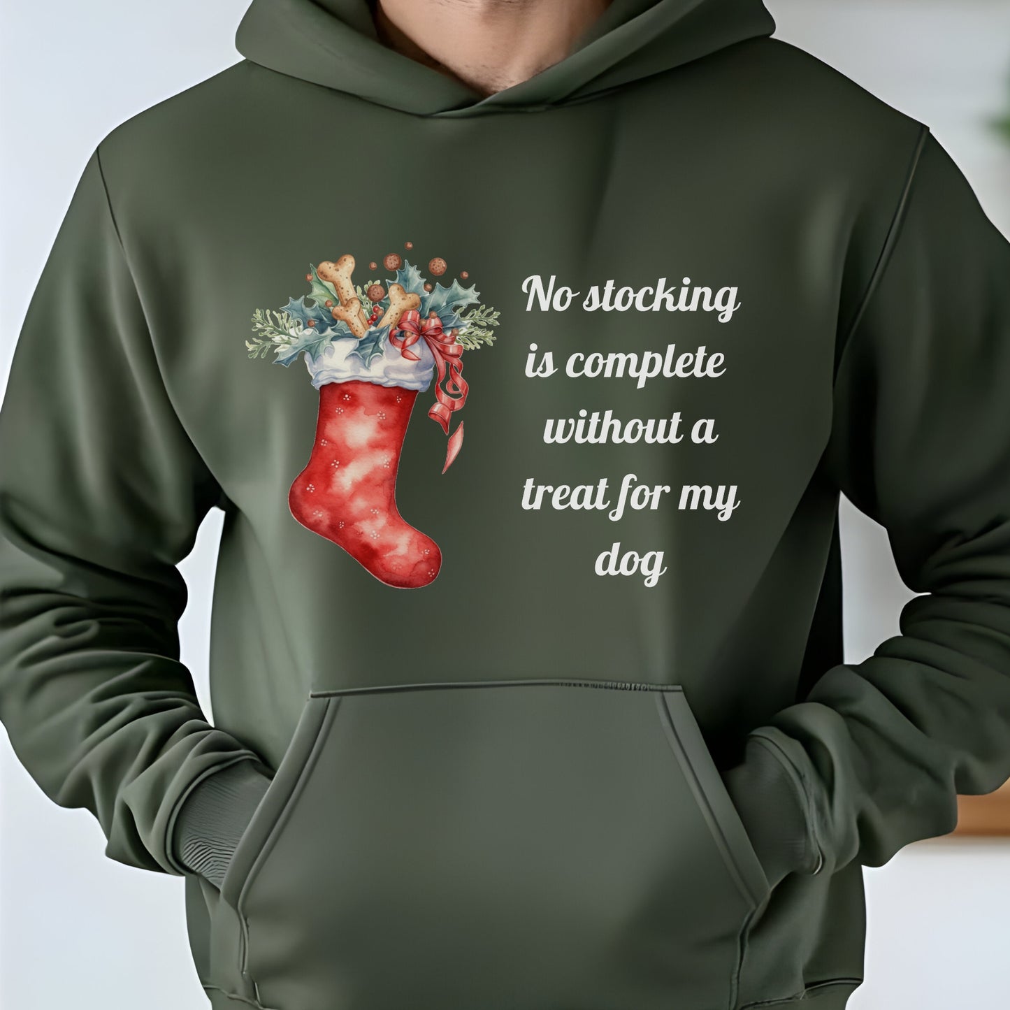 Military Green Christmas dog lover hoodie with a festive stocking filled with treats and a holiday quote reading “No stocking is complete without a treat for my dog.