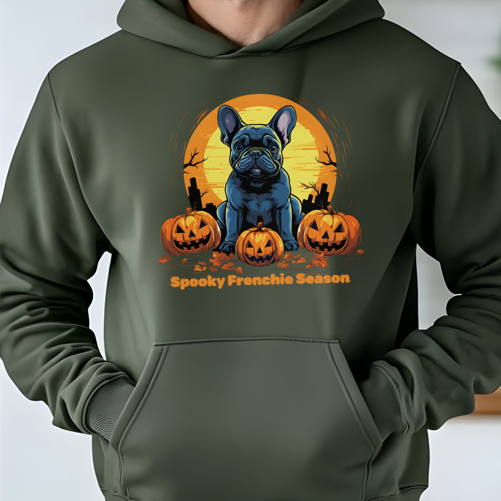 Military Green Halloween hoodie with French Bulldog, pumpkins, and graveyard, with "Spooky Frenchie Season" text