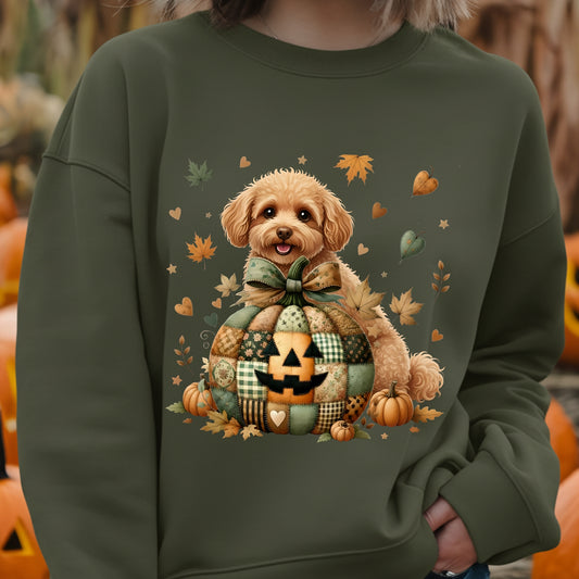 Green sweatshirt with a dog and autumn-themed design, worn by a person.