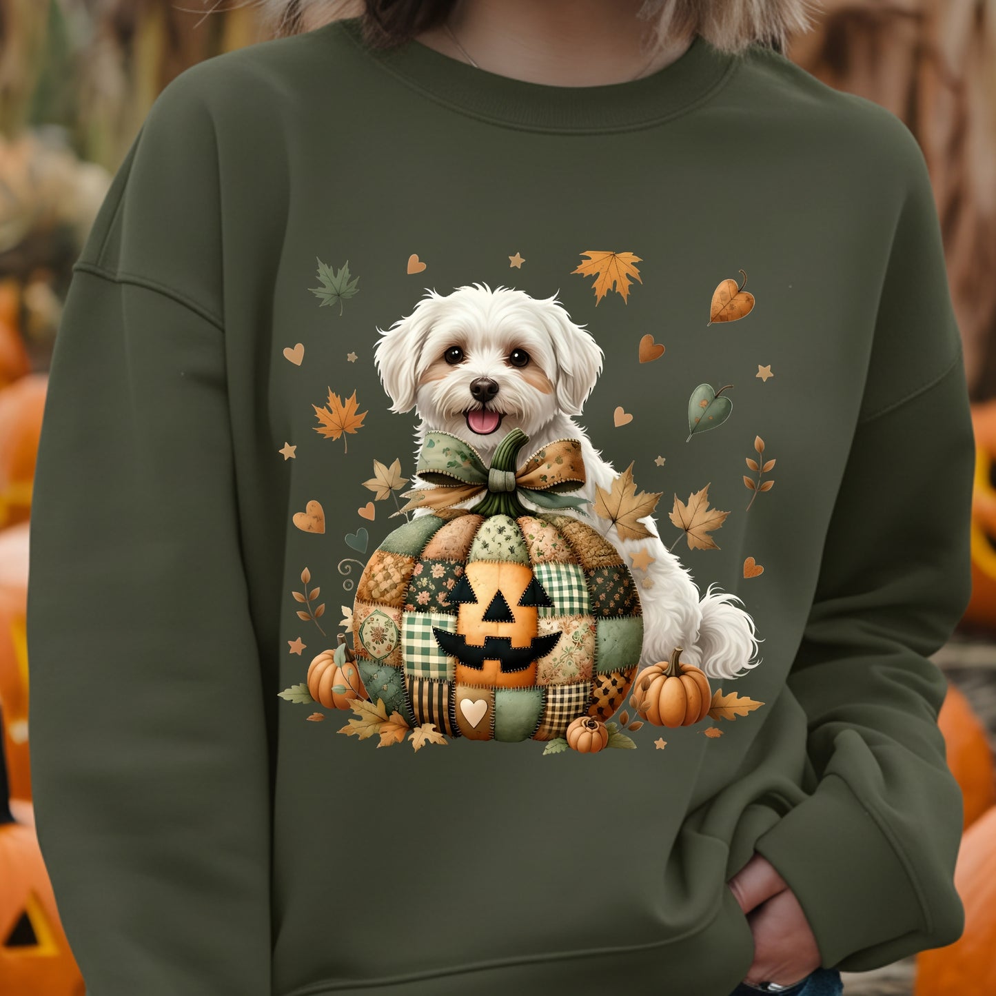 Green sweatshirt with a dog and Halloween-themed design, worn by a person.