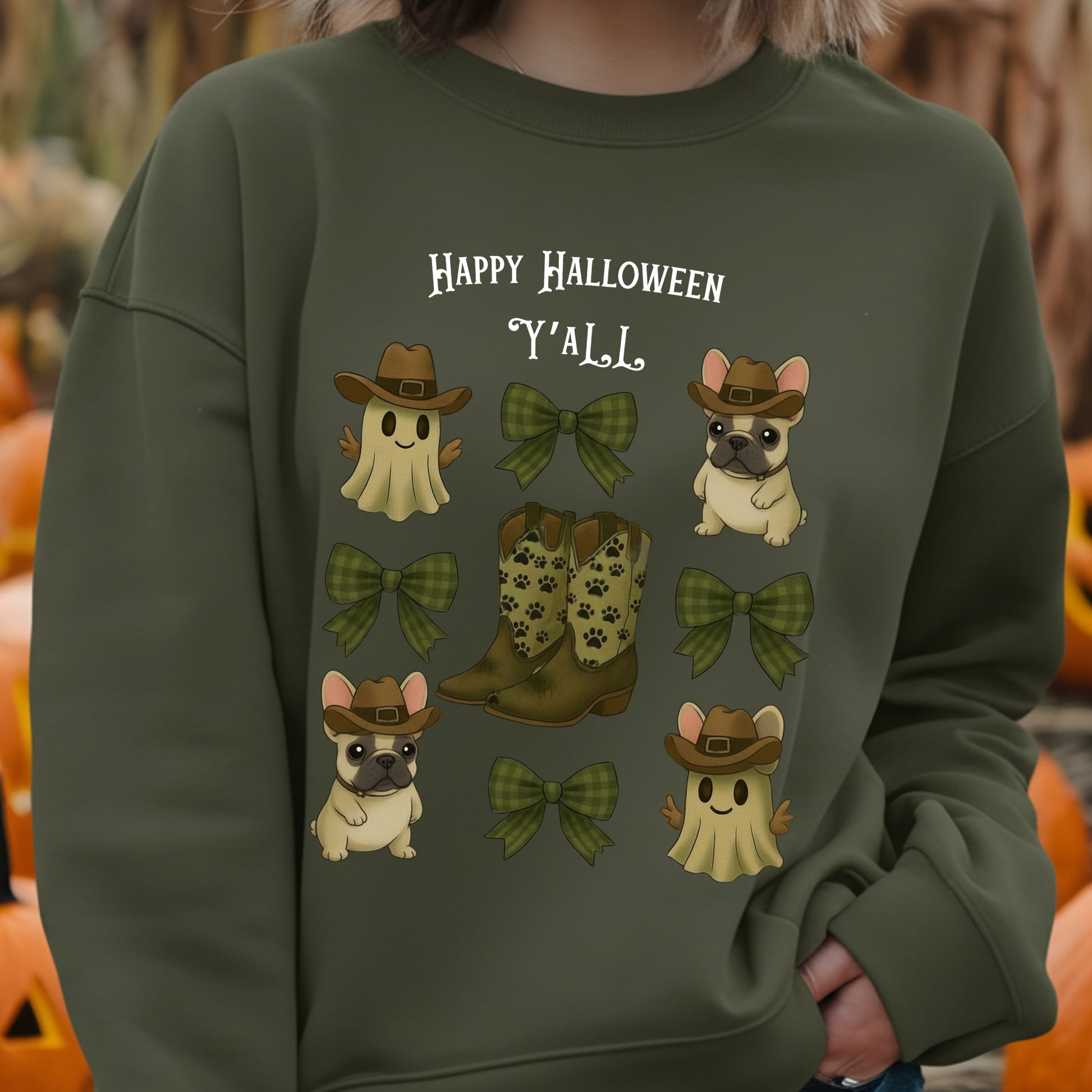 Green sweatshirt with Halloween-themed graphics and text, featuring ghosts, dogs, boots, and bows.