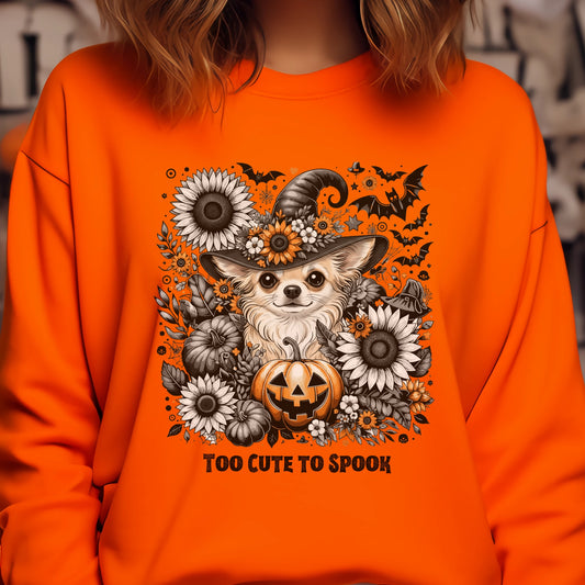 Orange sweatshirt with a Halloween-themed design featuring a dog, pumpkin, and flowers.