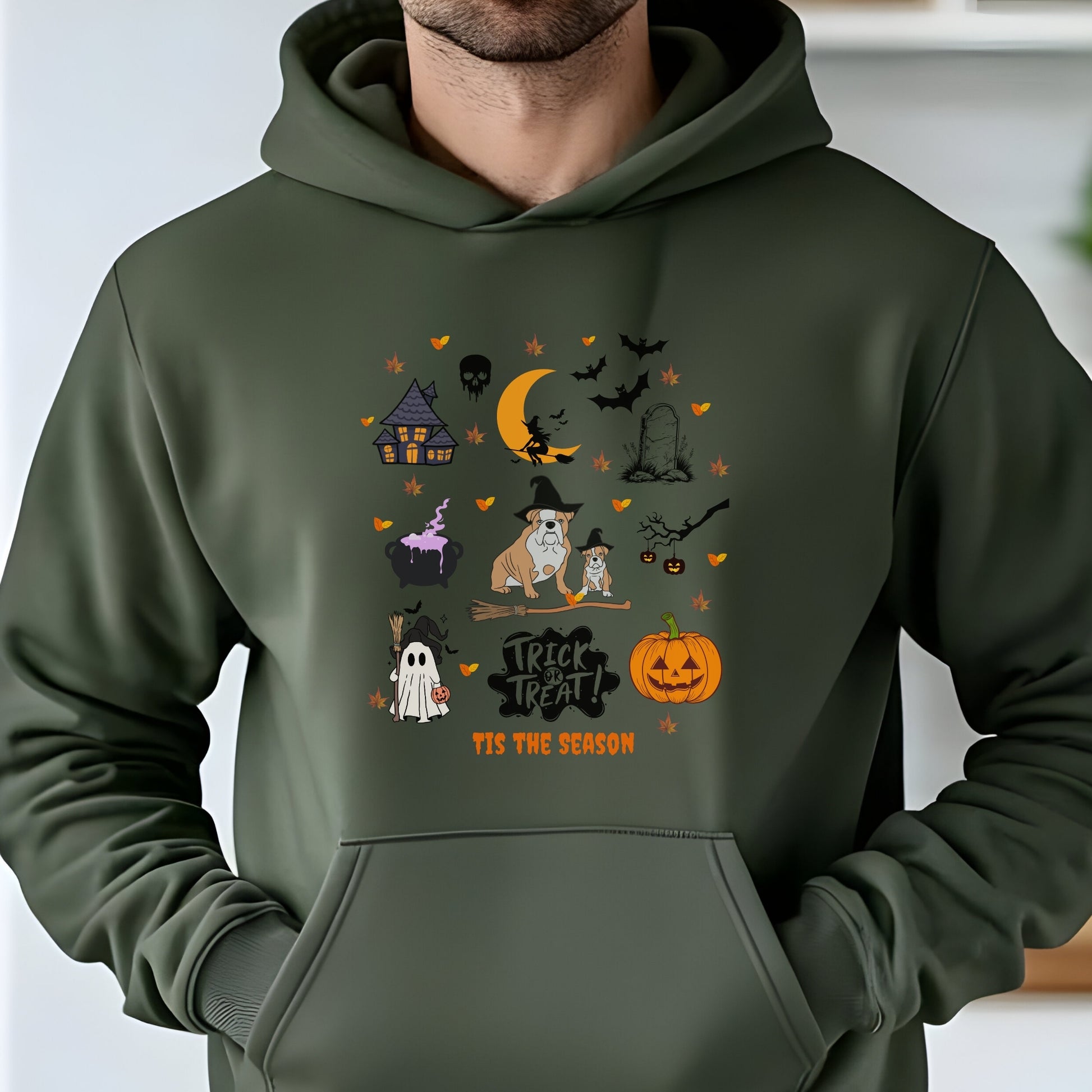 Military Green hoodie with Halloween themed dog and spooky icons, “Trick or Treat ‘Tis the Season” text, festive autumn design