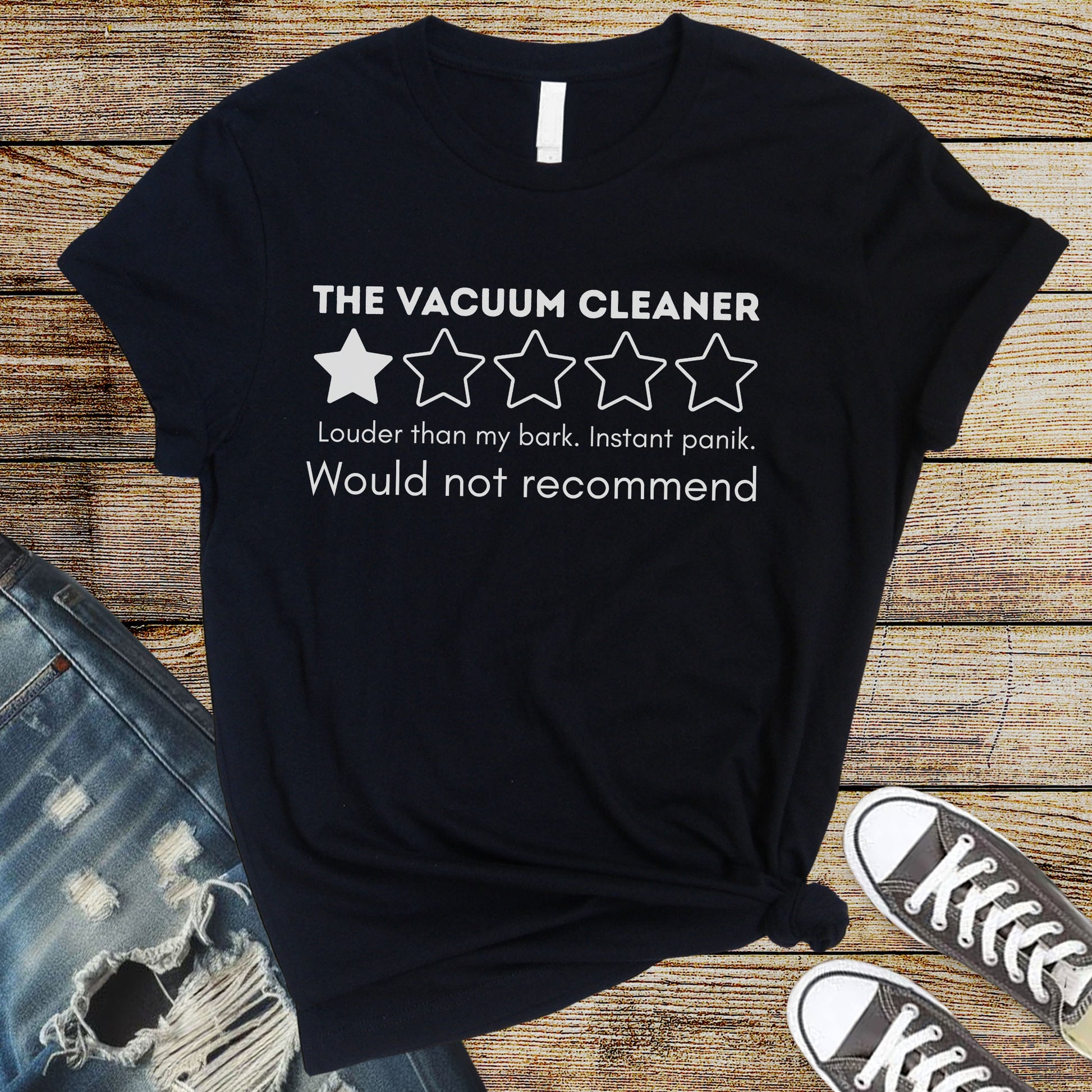 Black flat lay t-shirt with “Vacuum Cleaner 1 Star Review” design, funny dog saying “Louder than my bark. Instant panic. Would not recommend.”