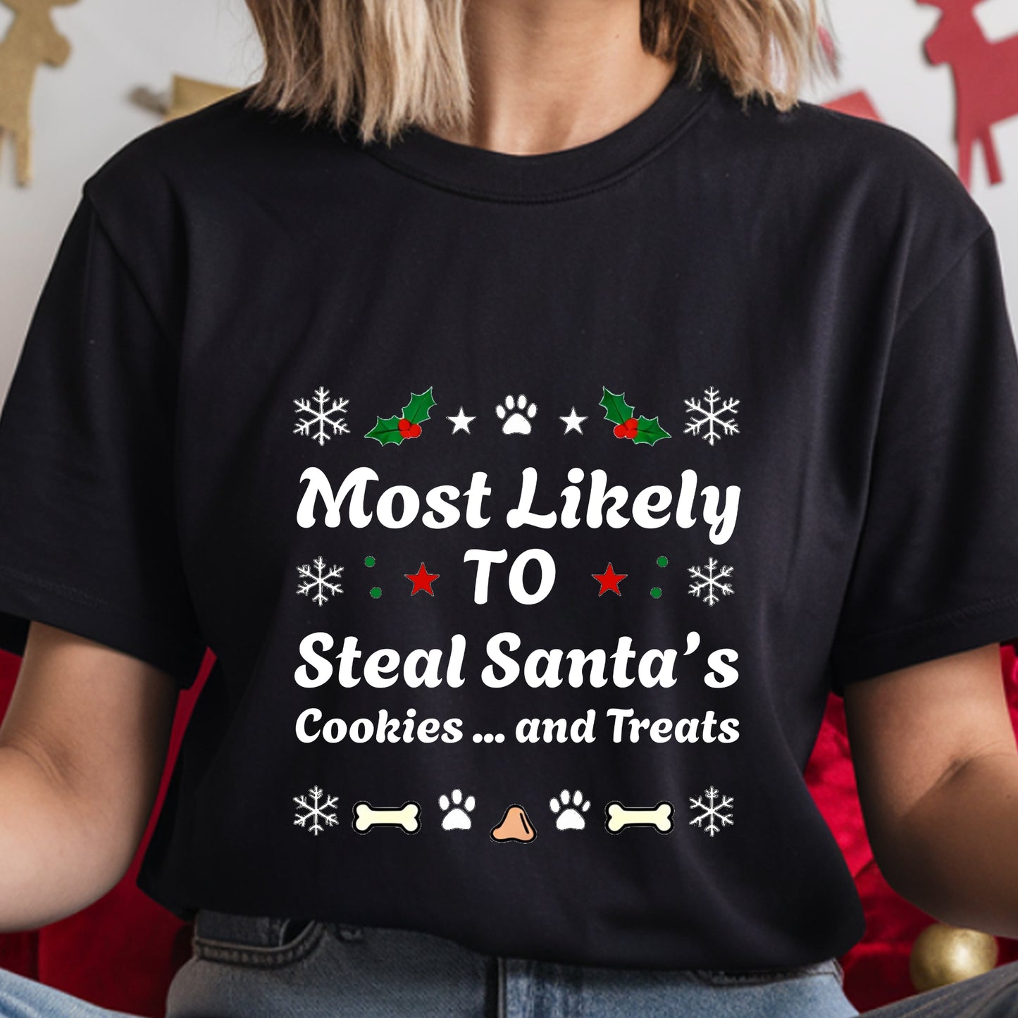 Black t-shirt with Christmas-themed text and graphics worn by a person.