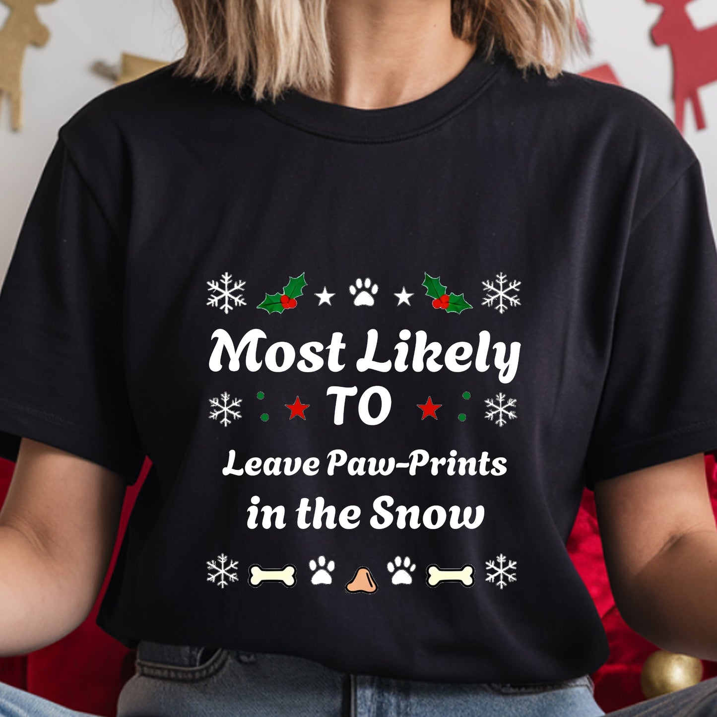 Black t-shirt with Christmas-themed text and graphics worn by a person.