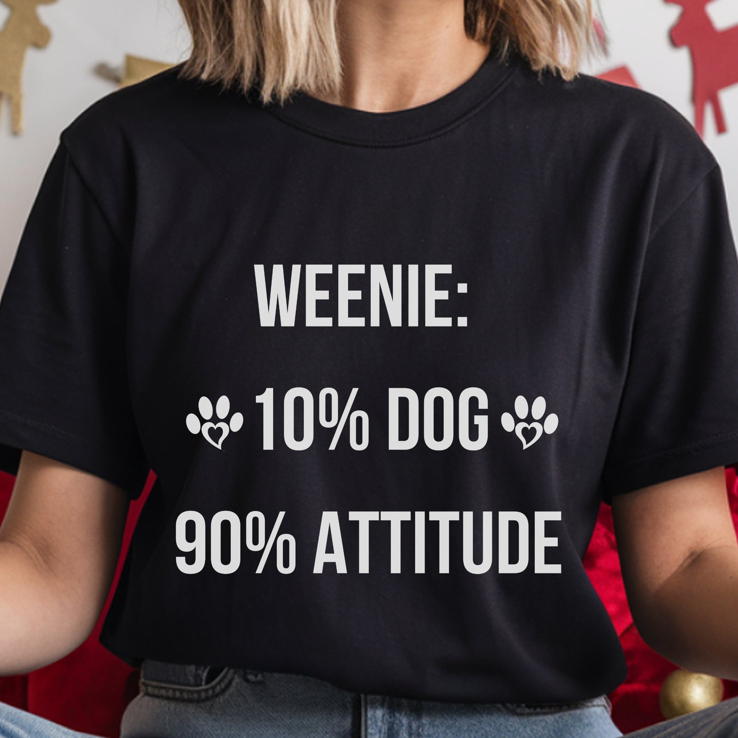 Person wearing a black t-shirt with humorous text design.