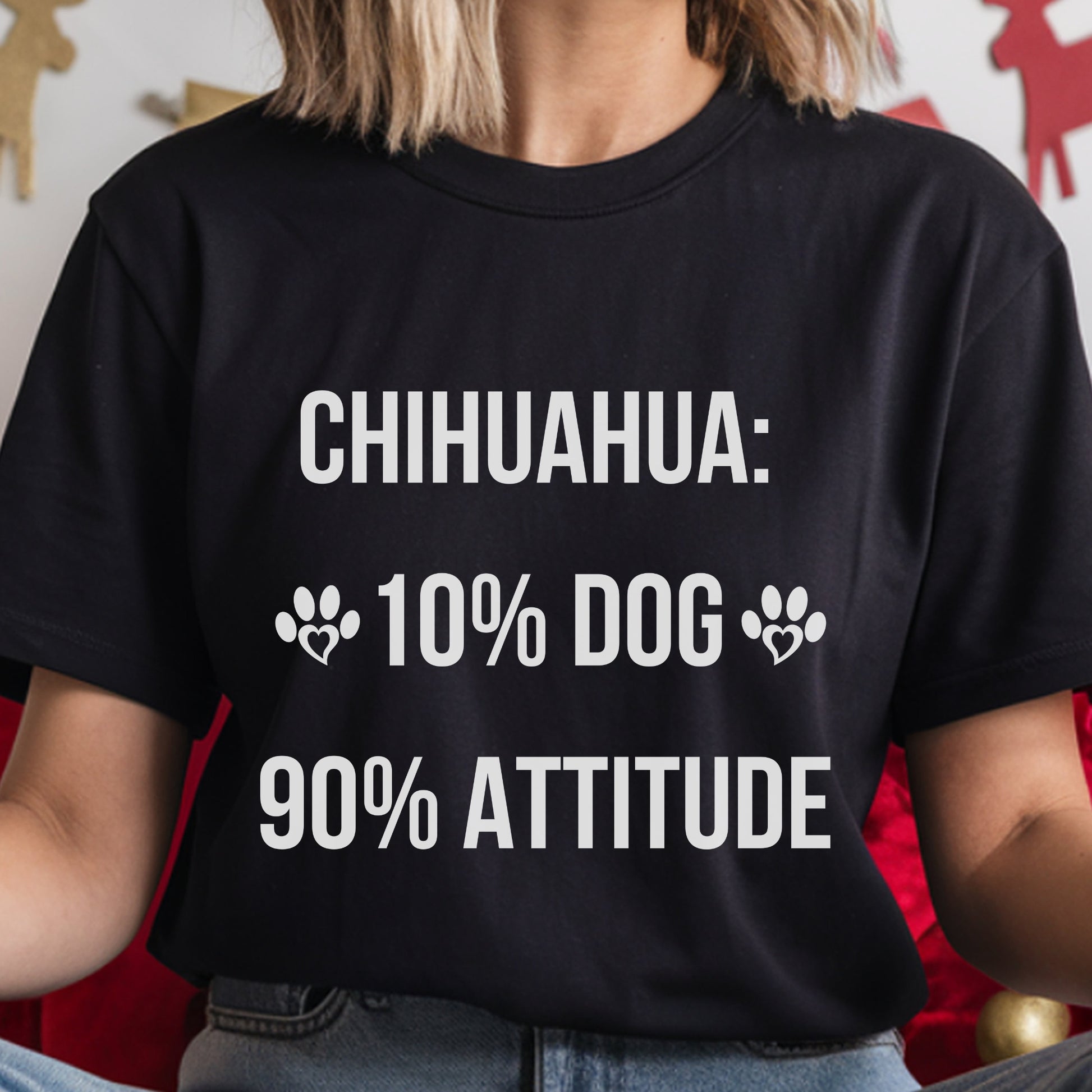 Person wearing a black t-shirt with white text about Chihuahuas.
