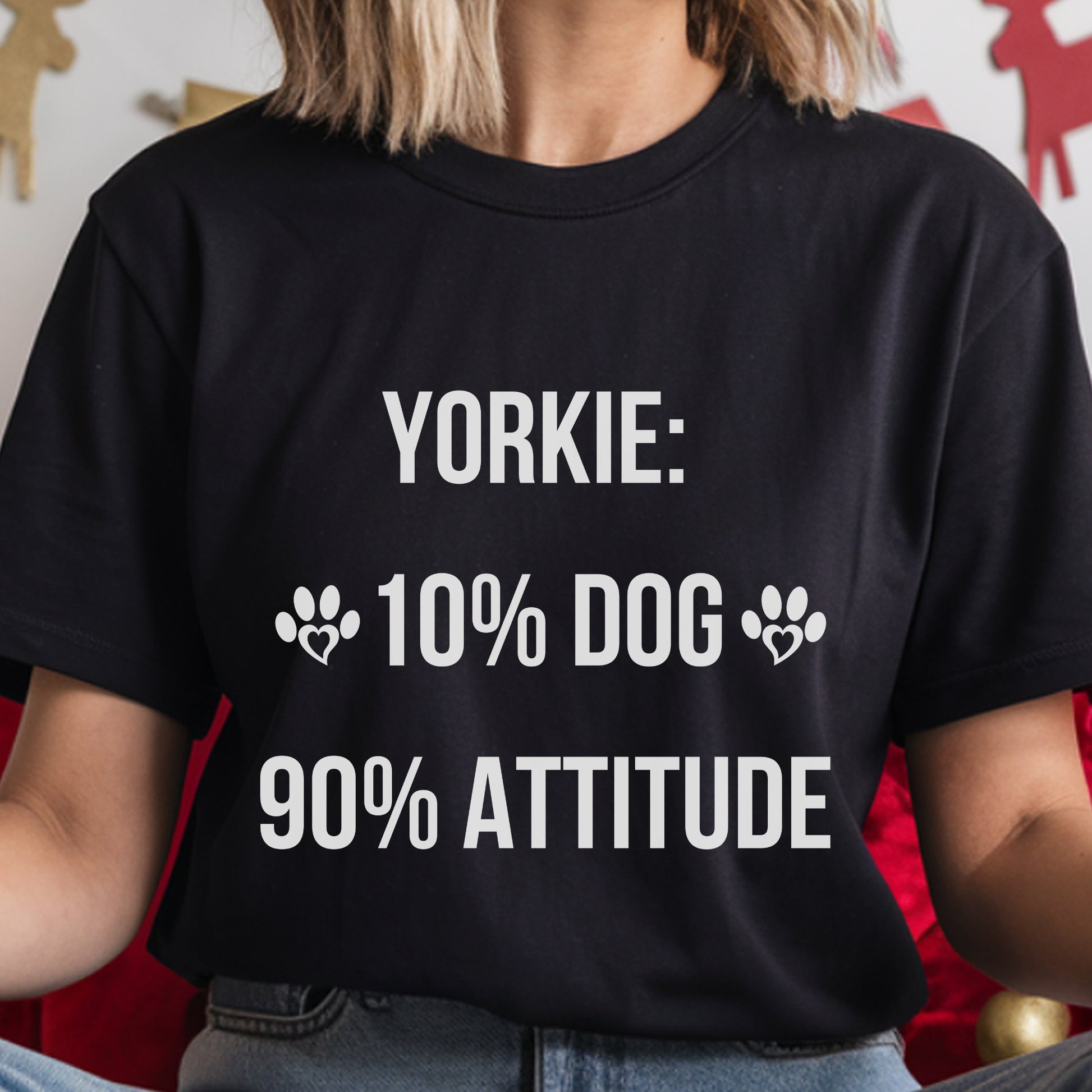 Person wearing a black t-shirt with white text about Yorkies