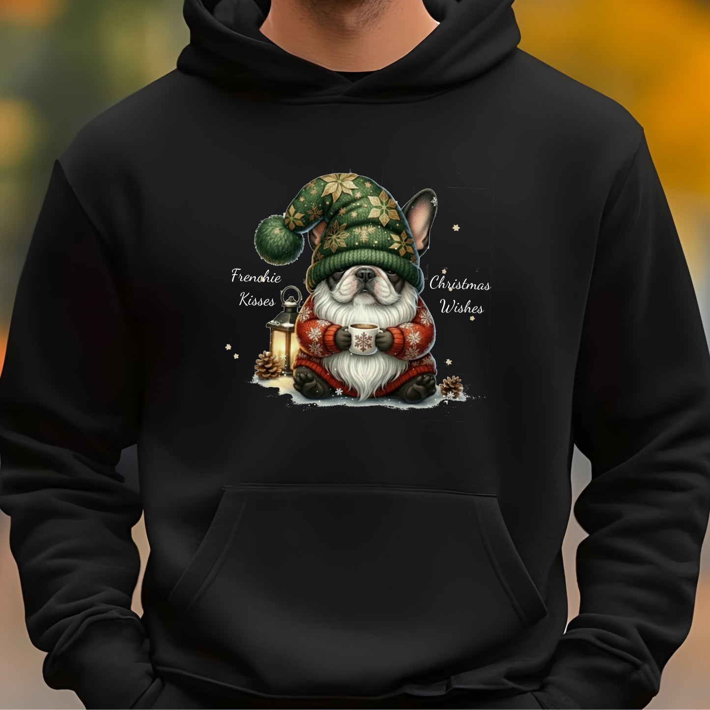 Black hoodie with adorable French Bulldog dressed as a Christmas gnome, holding a lantern in festive holiday attire