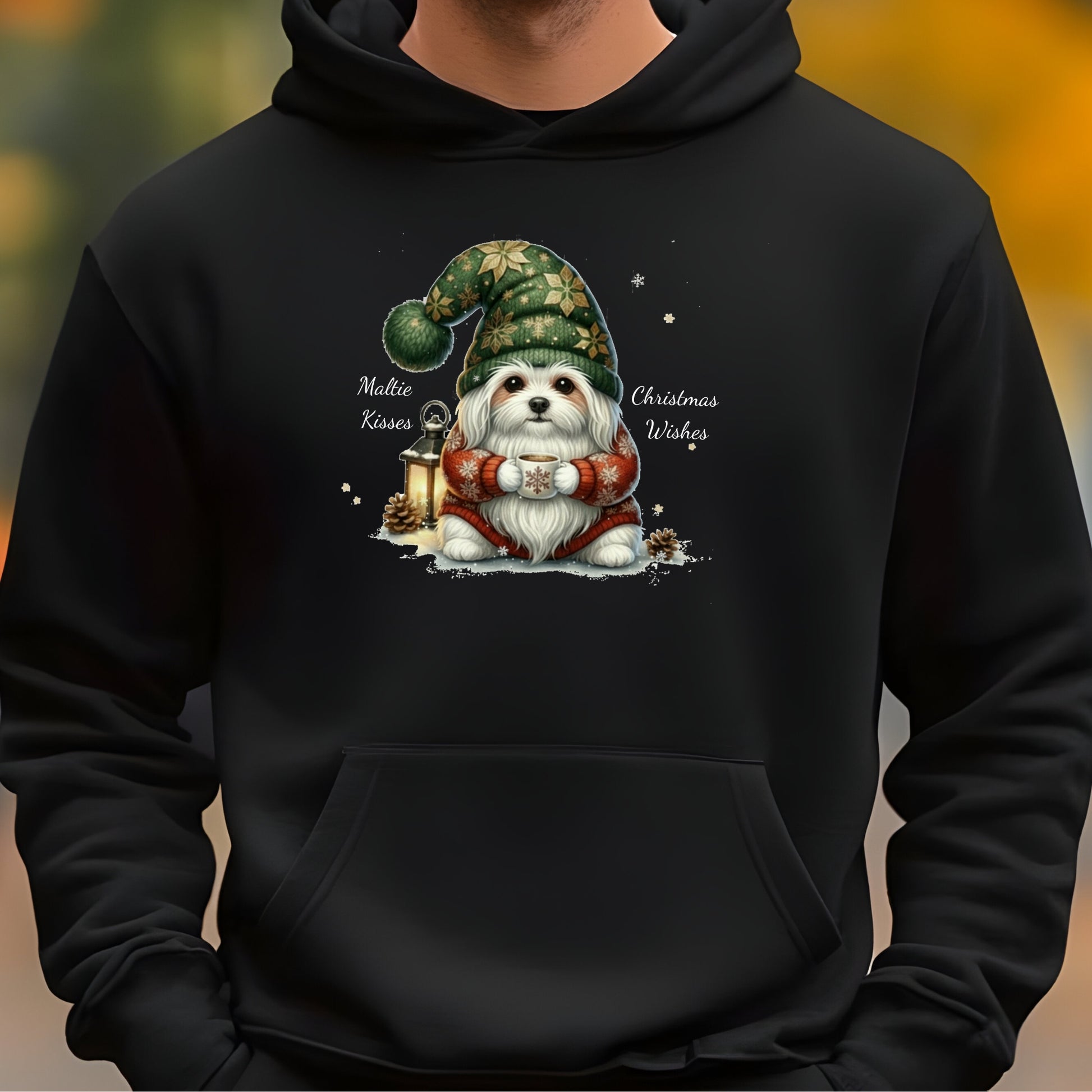 Black hoodie with a dog wearing a Christmas gnome hat design on a blurred background