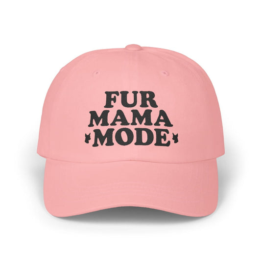 Pink "Fur Mama Mode" Miniature Pinscher cap on a wooden table at the beach, perfect for dog moms and Min Pin lovers