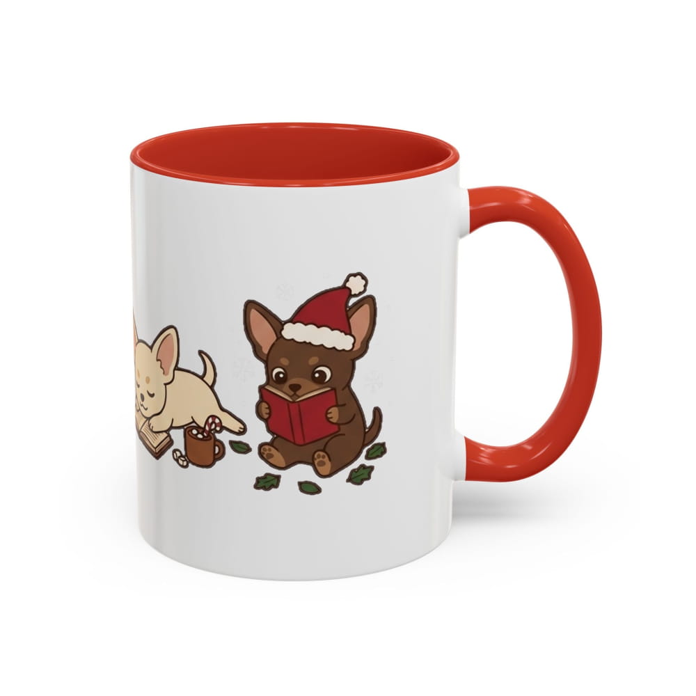 A white ceramic mug with a red interior and red handle, featuring a cute cartoon illustration of two chihuahuas on the side. One chihuahua is tan and drinking from a small brown mug, while the other is brown, wearing a Santa hat and reading a red book.