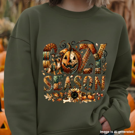 Person wearing a green sweatshirt with 'Happy Halloween' design in front of pumpkins.