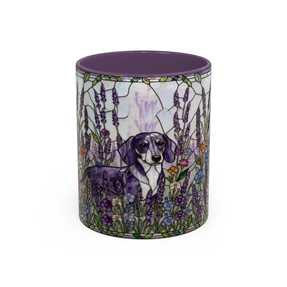 A ceramic mug featuring a purple and white dachshund surrounded by lavender and wildflowers, with a solid purple interior and rim, set against a plain white background.