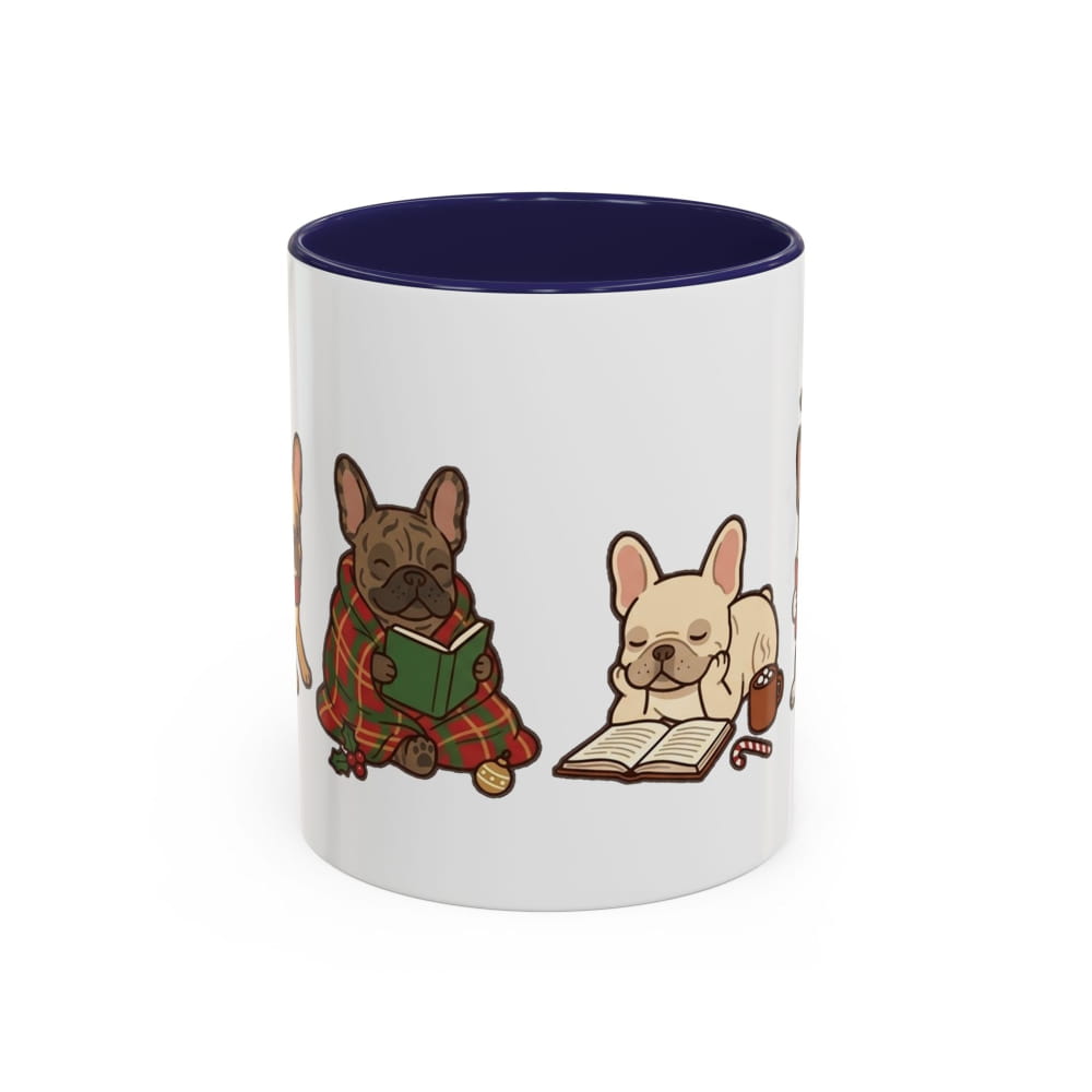 A white ceramic mug with a dark navy blue interior, featuring a cute cartoon illustration of two French bulldogs reading books on the side.