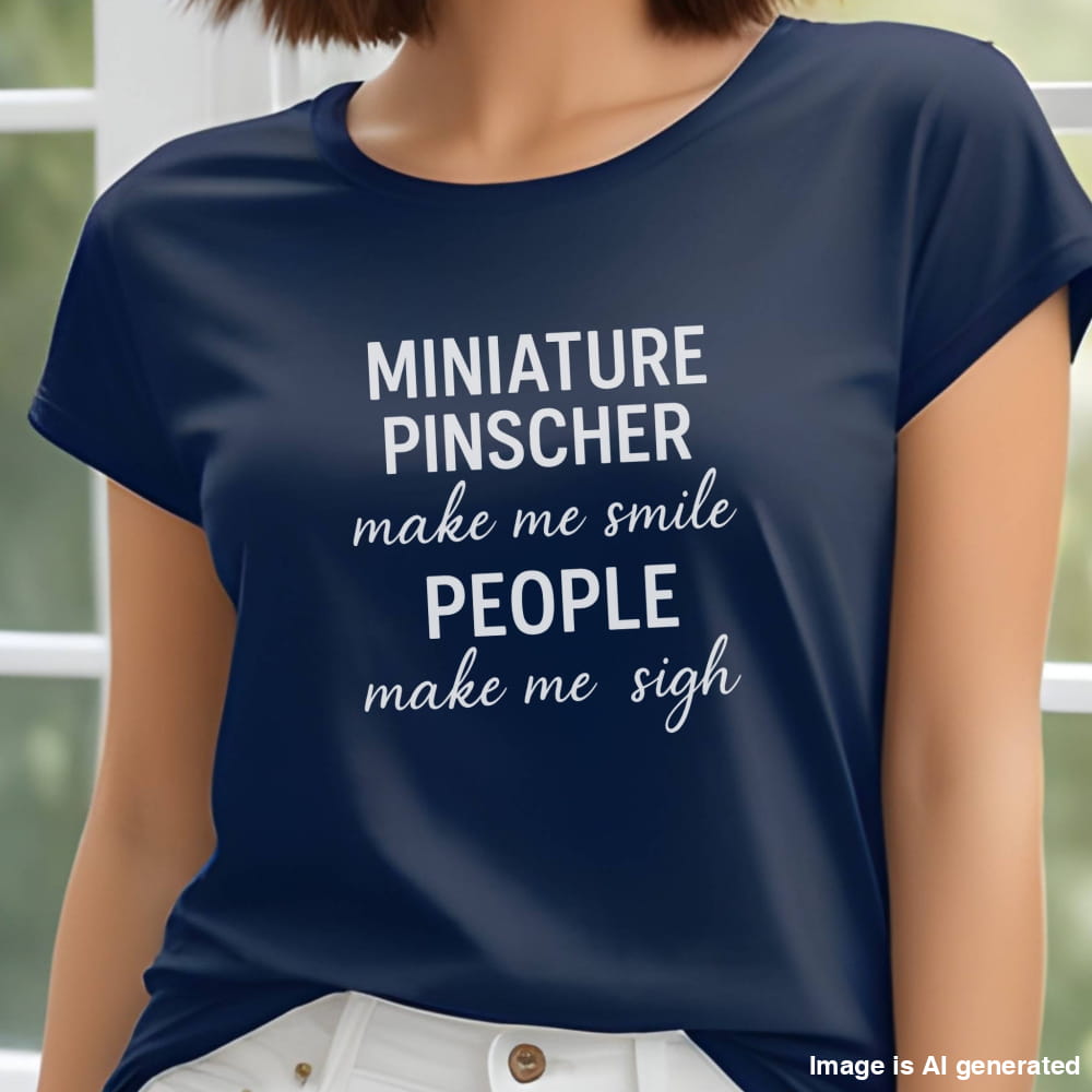 Woman wearing a navy"Miniature Pinscher make me smile, people make me sigh" unisex t-shirt, casual background