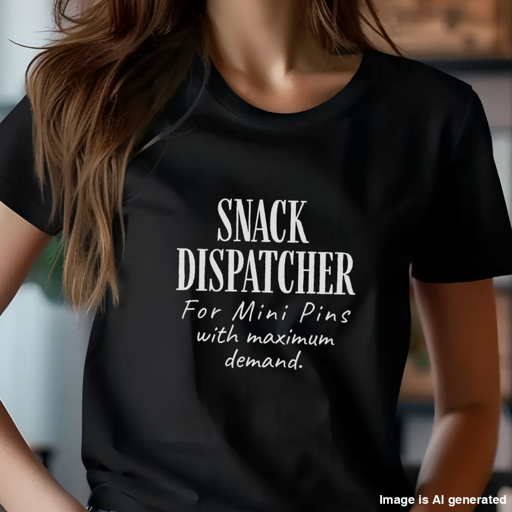 Woman wearing a black t-shirt with black text: "SNACK DISPATCHER – For Mini Pins with maximum demand
