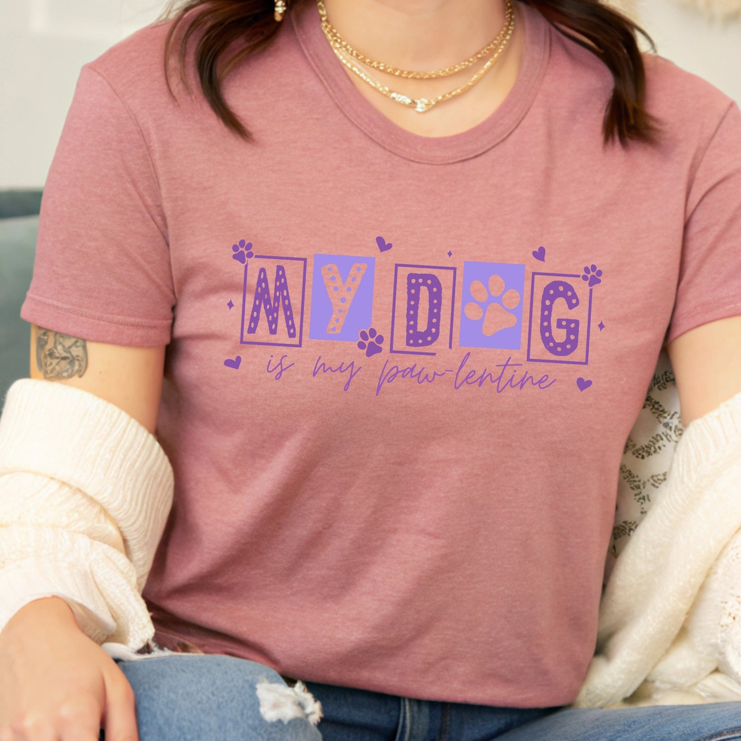 Person wearing a pink t-shirt with 'My dog is my paw-entine' text.