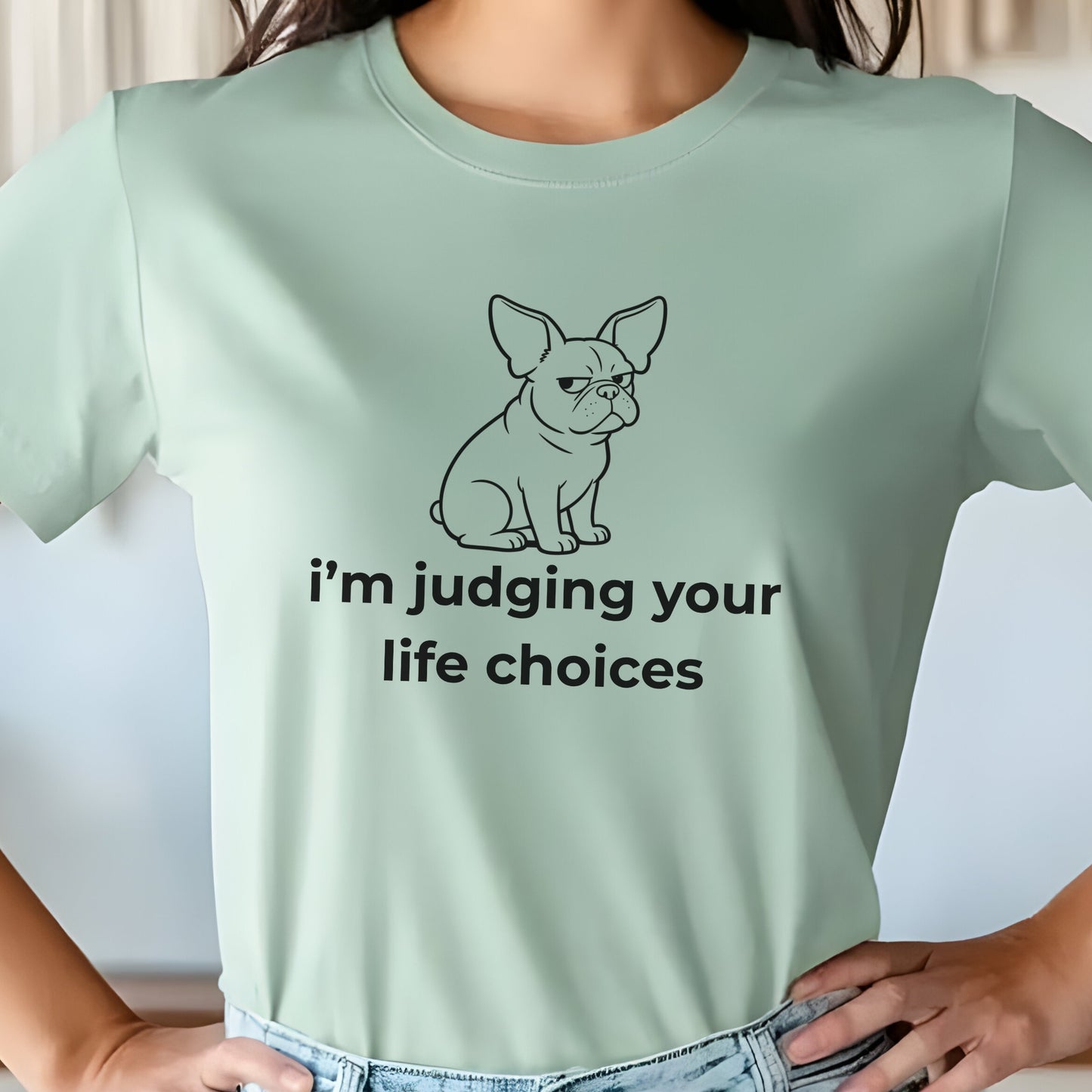 Light green t-shirt with a dog graphic and text on a plain background