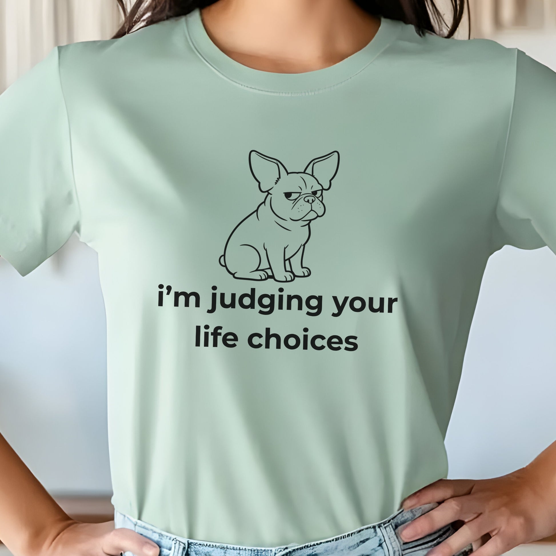 Light green t-shirt with a dog graphic and text on a plain background