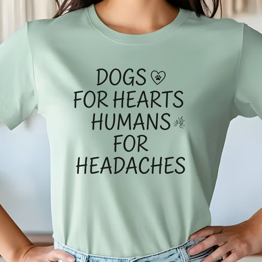 Light green t-shirt with text 'DOGS FOR HEARTS HUMANS FOR HEADACHES' worn by a person.