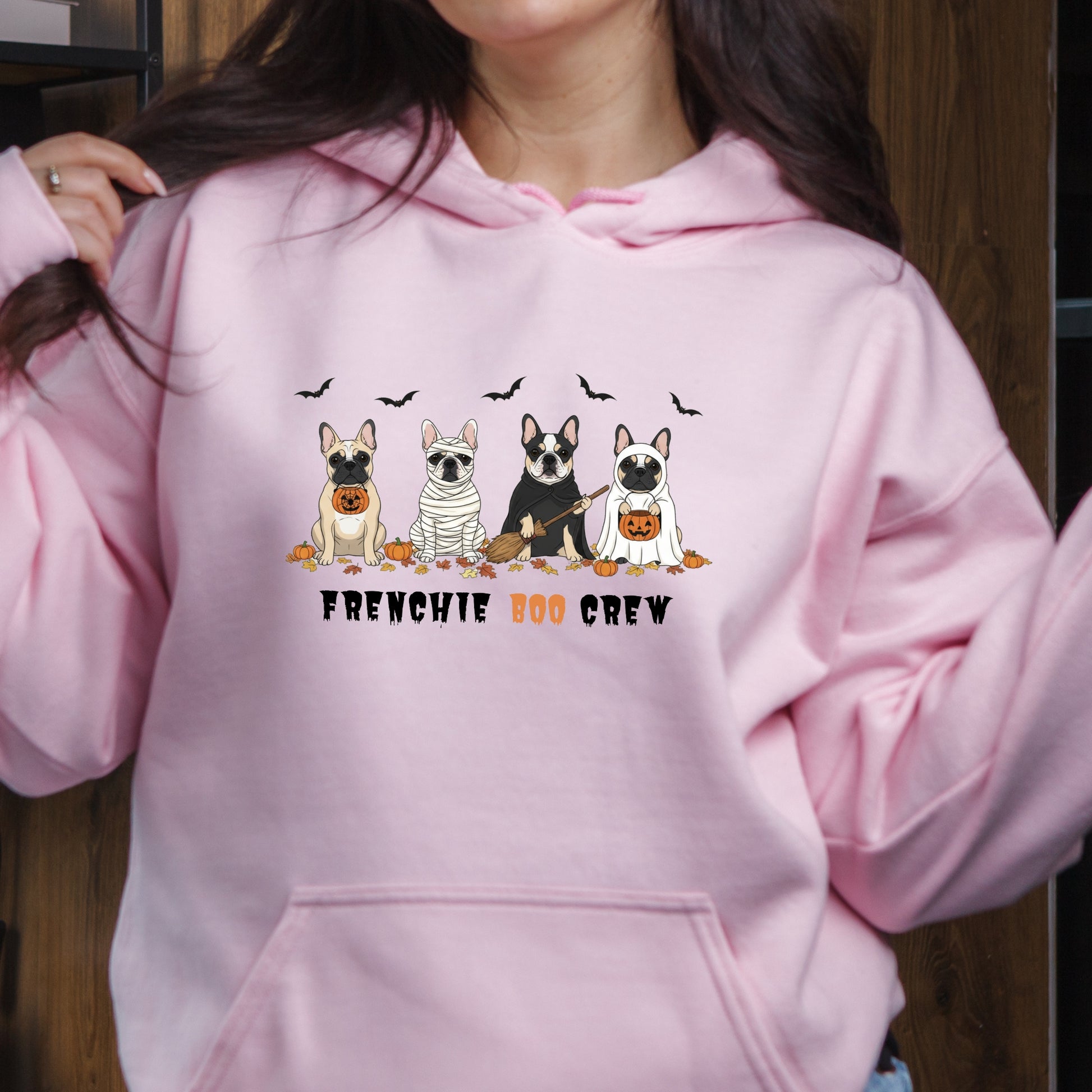 Halloween hoodie with four cartoon French Bulldogs in costumes, bats and pumpkins, and “Frenchie Boo Crew” text on white fabric.