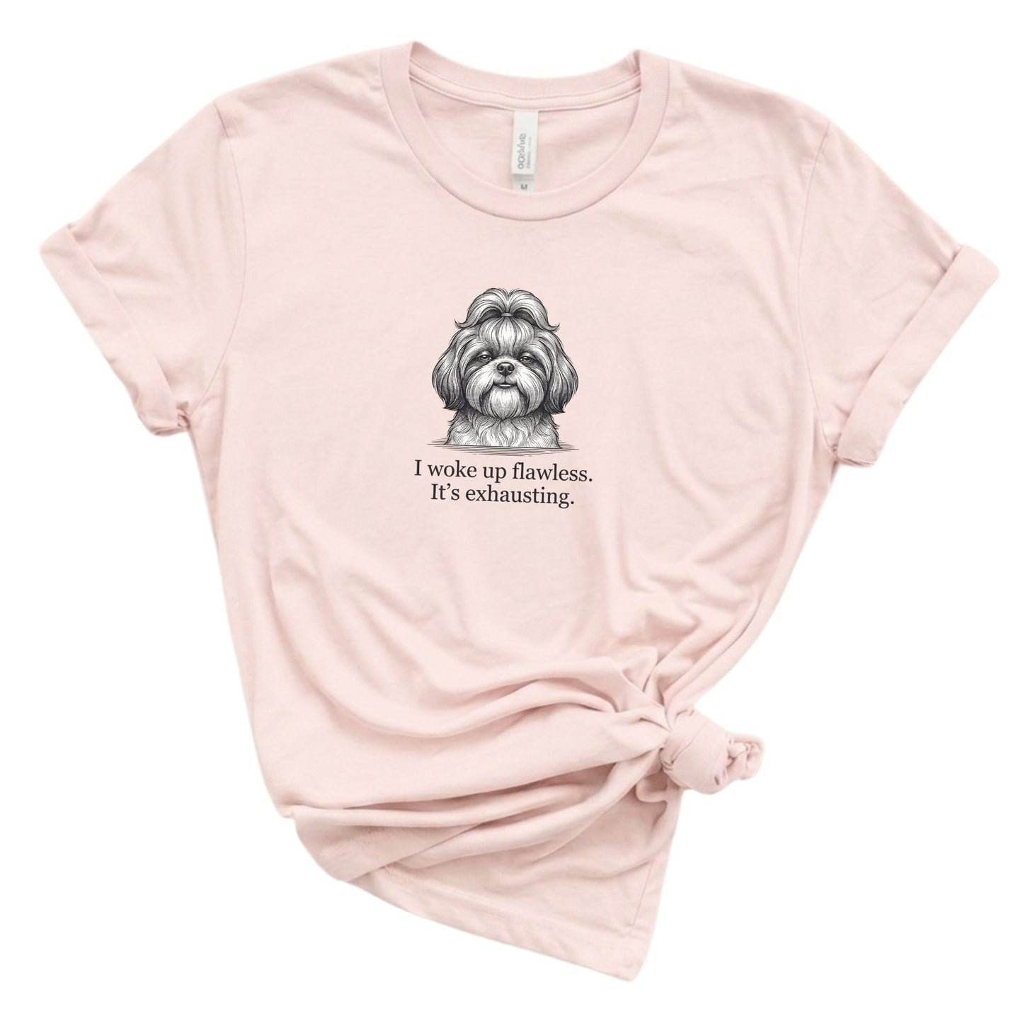 Pink t-shirt with a dog illustration and text on a white background