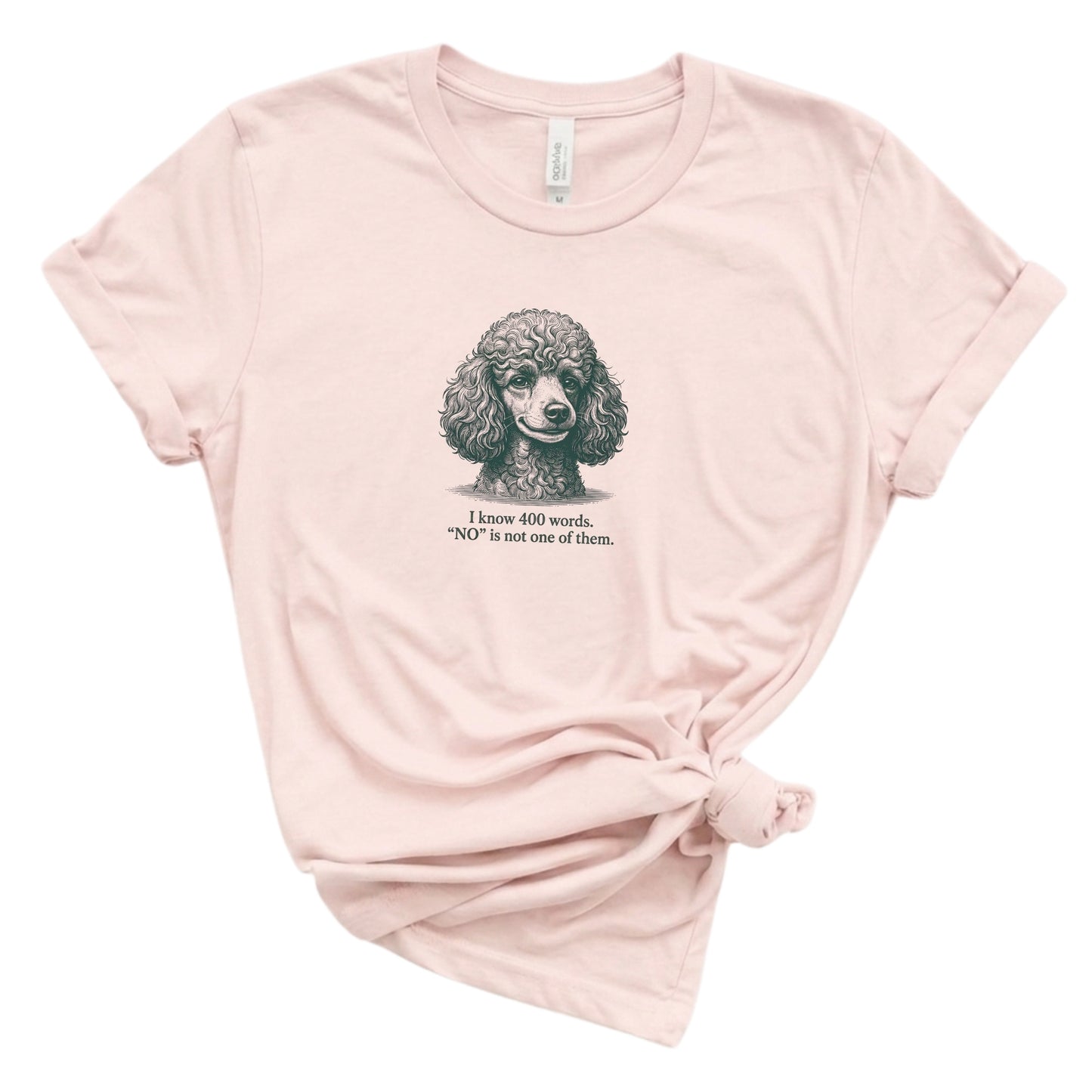Pink t-shirt with a poodle graphic and text on a white background