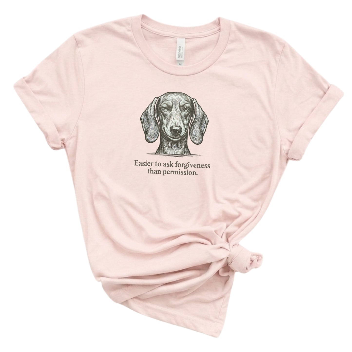 Pink t-shirt with a dachshund graphic and text on a white background