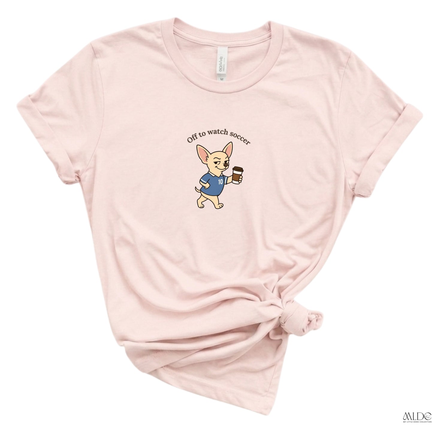 Pink t-shirt with a dog graphic and text on a white background