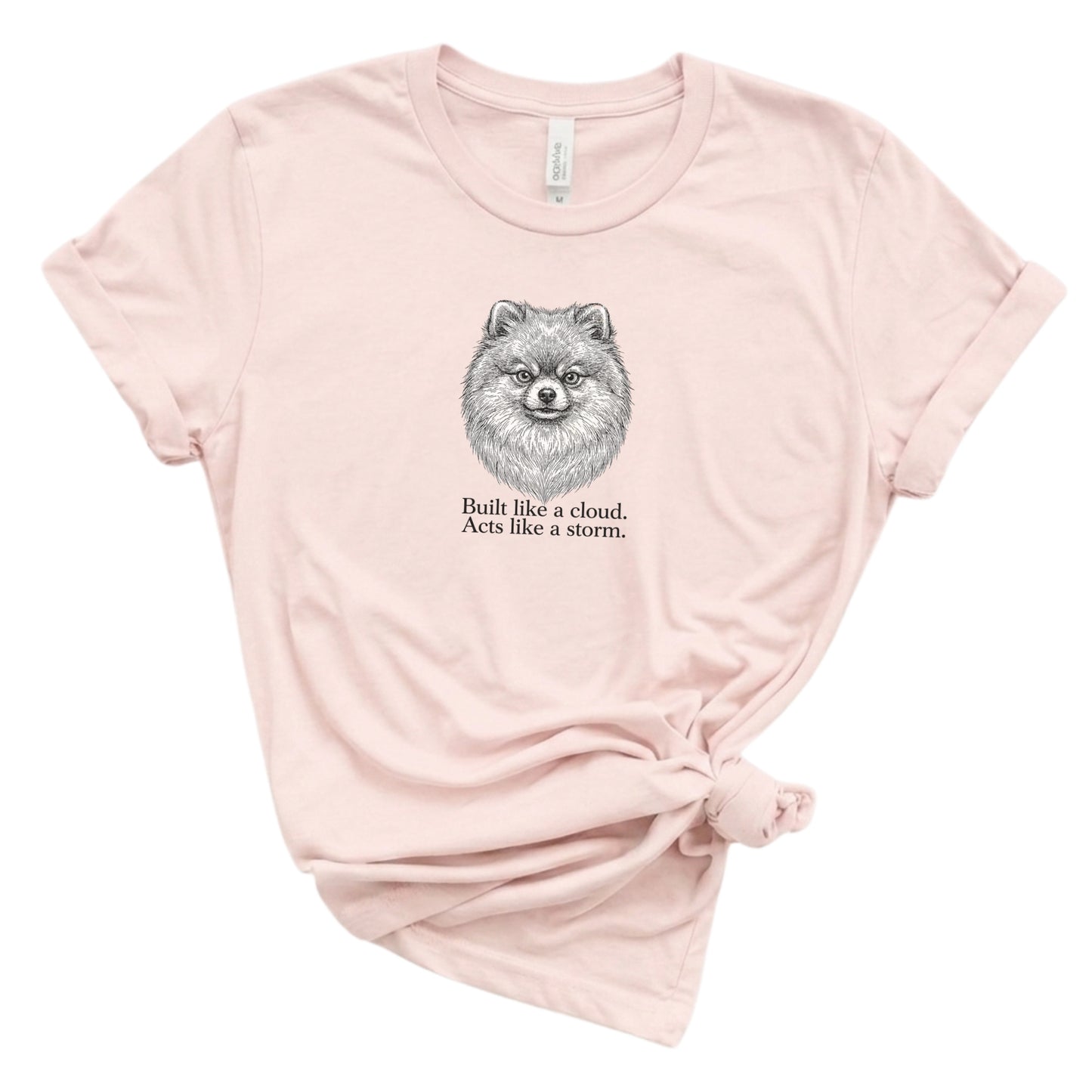 Pink t-shirt with a dog illustration and text on a white background