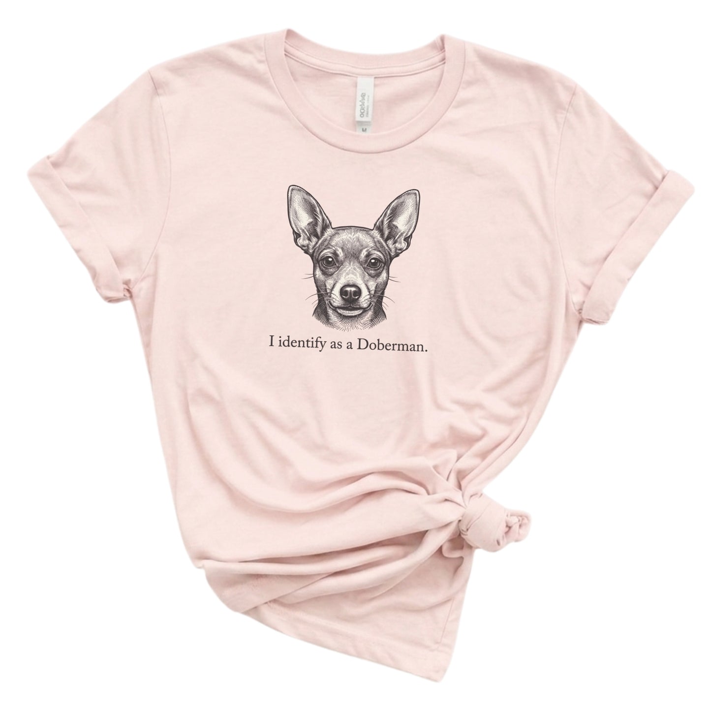 Pink t-shirt with a Doberman graphic and text on a white background