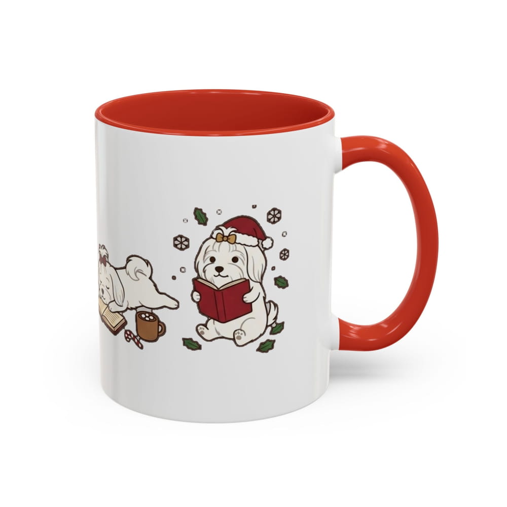 White ceramic mug with a red interior and red handle, showing a Maltese in a Santa hat reading a red book, with another Maltese lying beside it.
