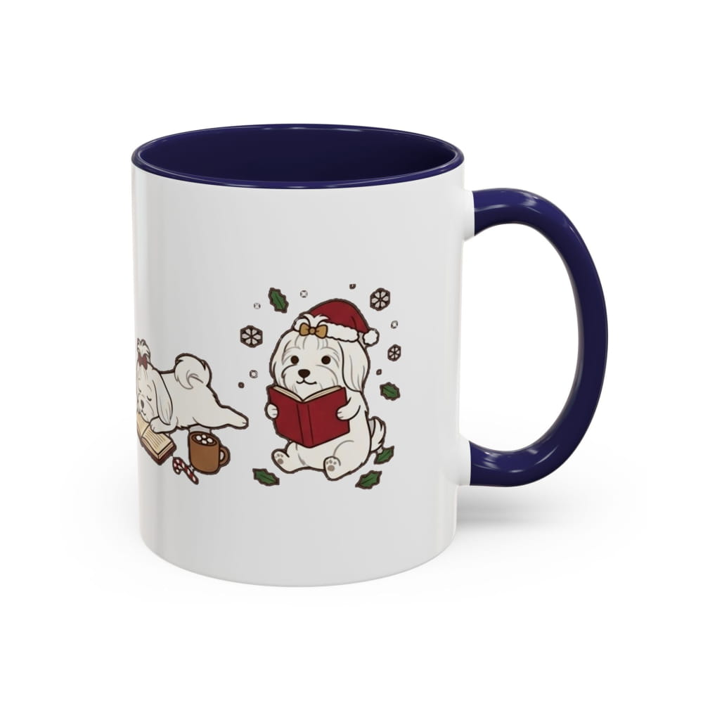 White ceramic mug with a navy interior and navy handle, showing a Maltese in a Santa hat reading a red book, with another Maltese lying beside it.