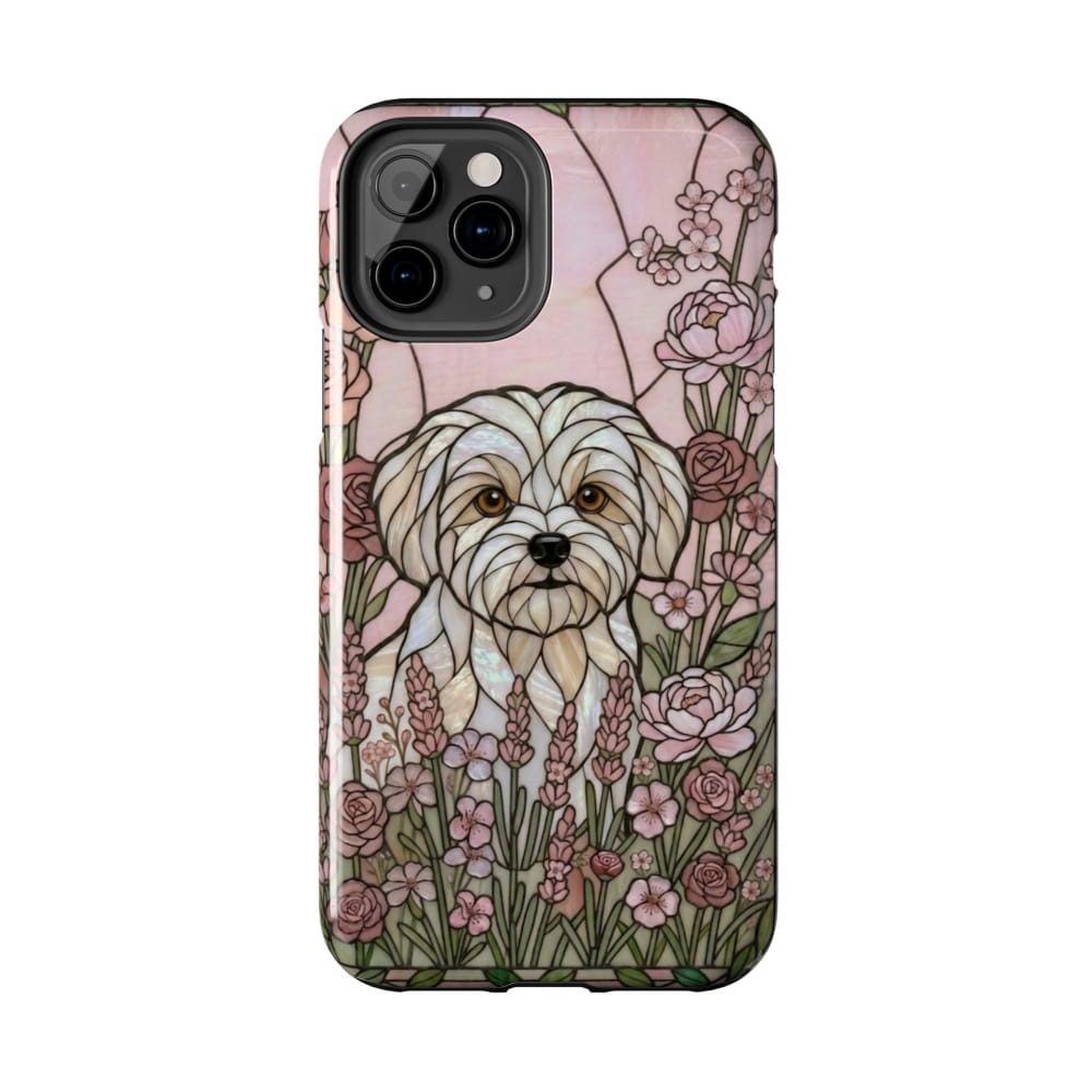 Phone case with a dog illustration and floral design on a pink background