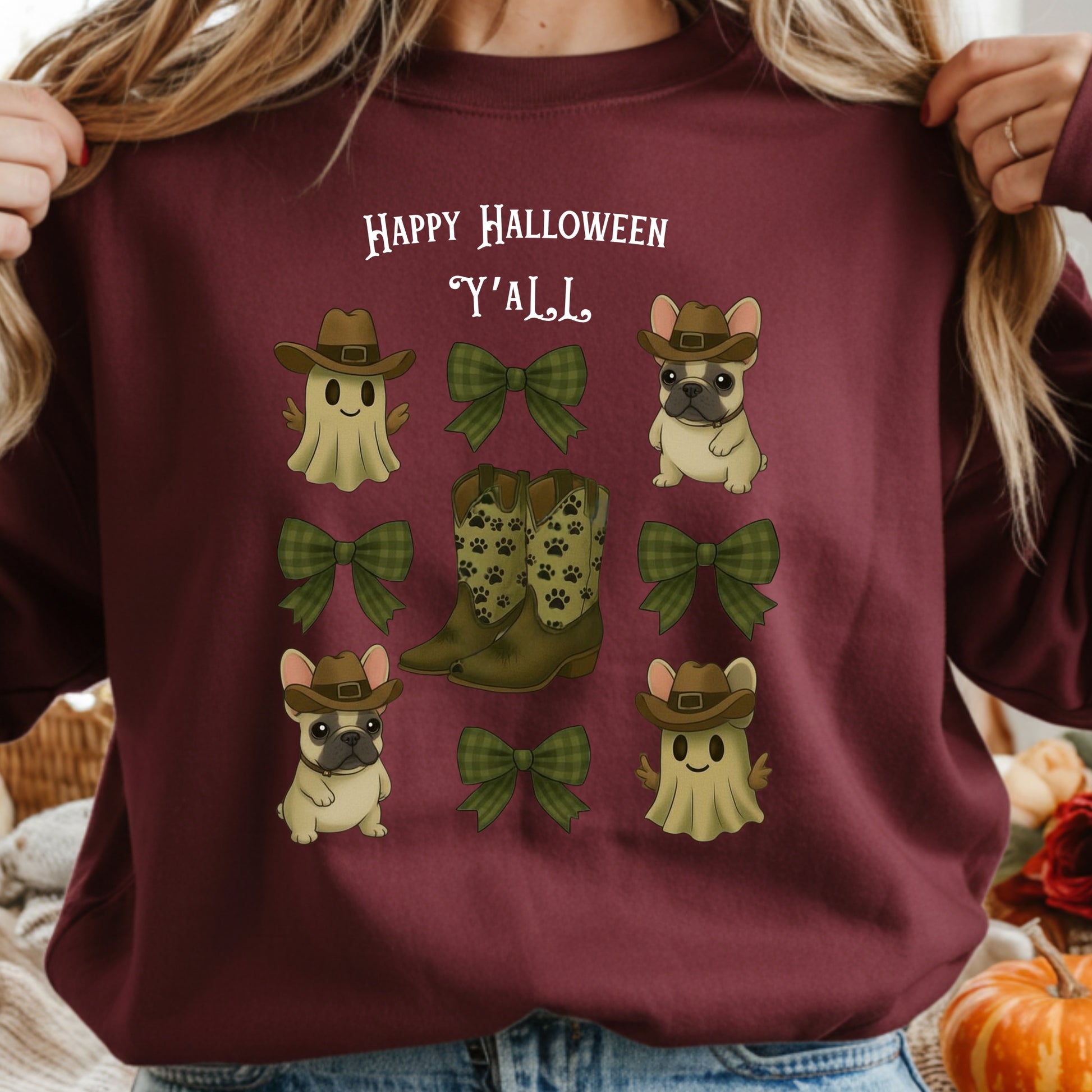 Maroon sweatshirt with Halloween-themed graphics including dogs, boots, and ghosts.