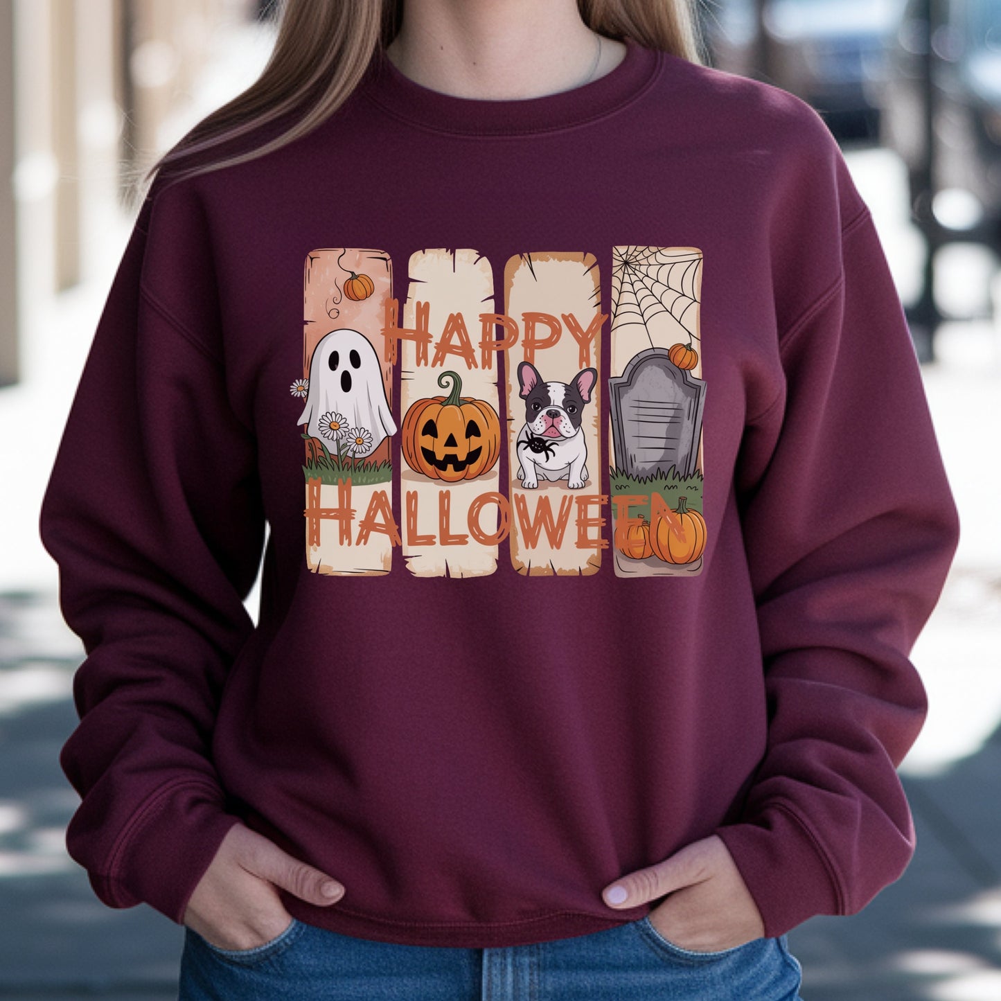 Maroon sweatshirt with “Happy Halloween” design featuring a ghost, jack-o’-lantern, French Bulldog, gravestone, pumpkins, and cute autumn graphics.