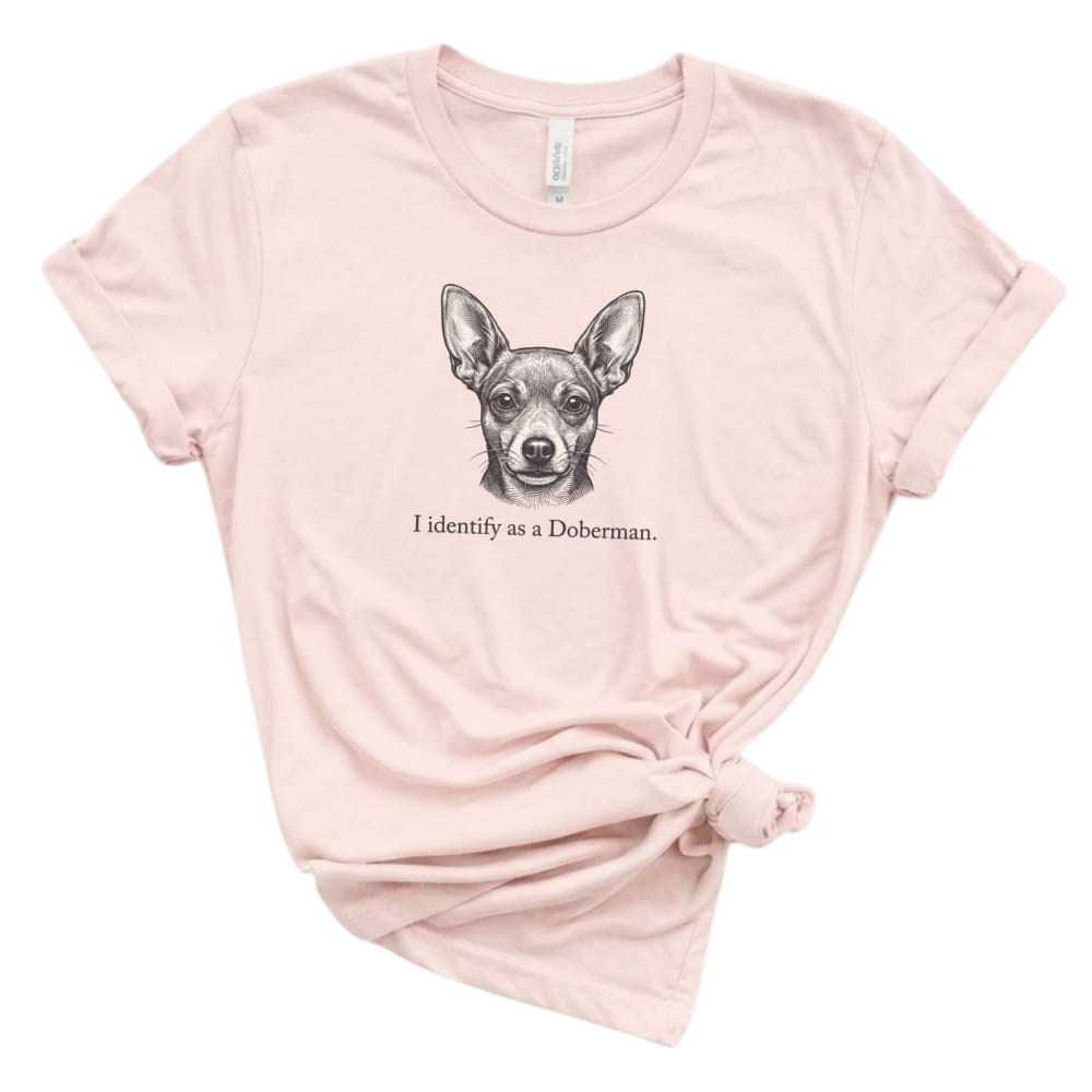 Pink t-shirt with a Doberman graphic and text on a white background