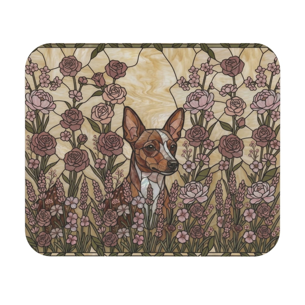 A square mouse pad with rounded corners featuring a stained-glass style illustration of a brown and white dog surrounded by pink roses and green foliage on a cream background.