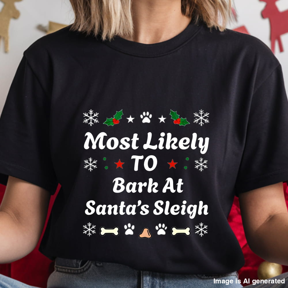 Black t-shirt with Christmas-themed text and graphics worn by a person.