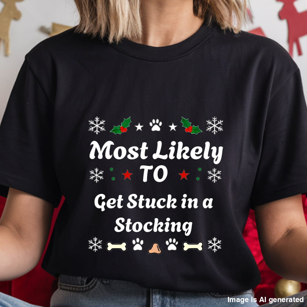 Black t-shirt with Christmas-themed text and graphics worn by a person.