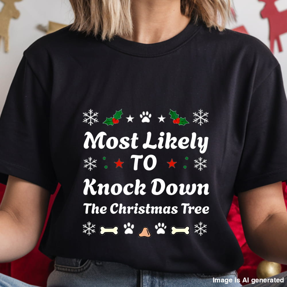 Black t-shirt with Christmas-themed text and graphics worn by a person.