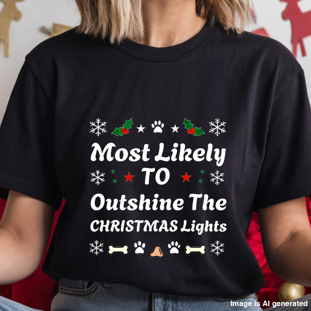 Black t-shirt with Christmas-themed text and graphics worn by a person.