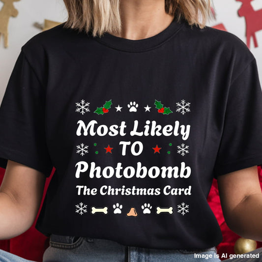 Black t-shirt with Christmas-themed text and graphics worn by a person.