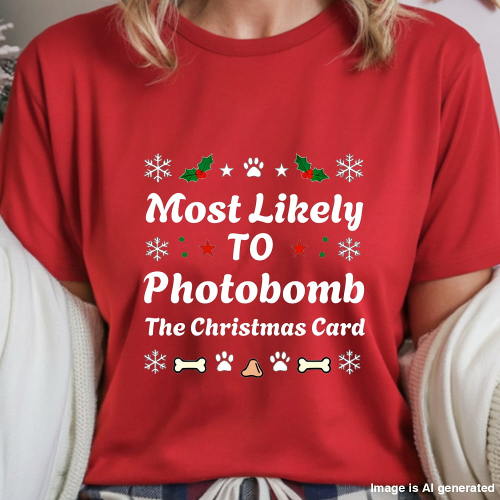 Red t-shirt with Christmas-themed text and graphics worn by a person.