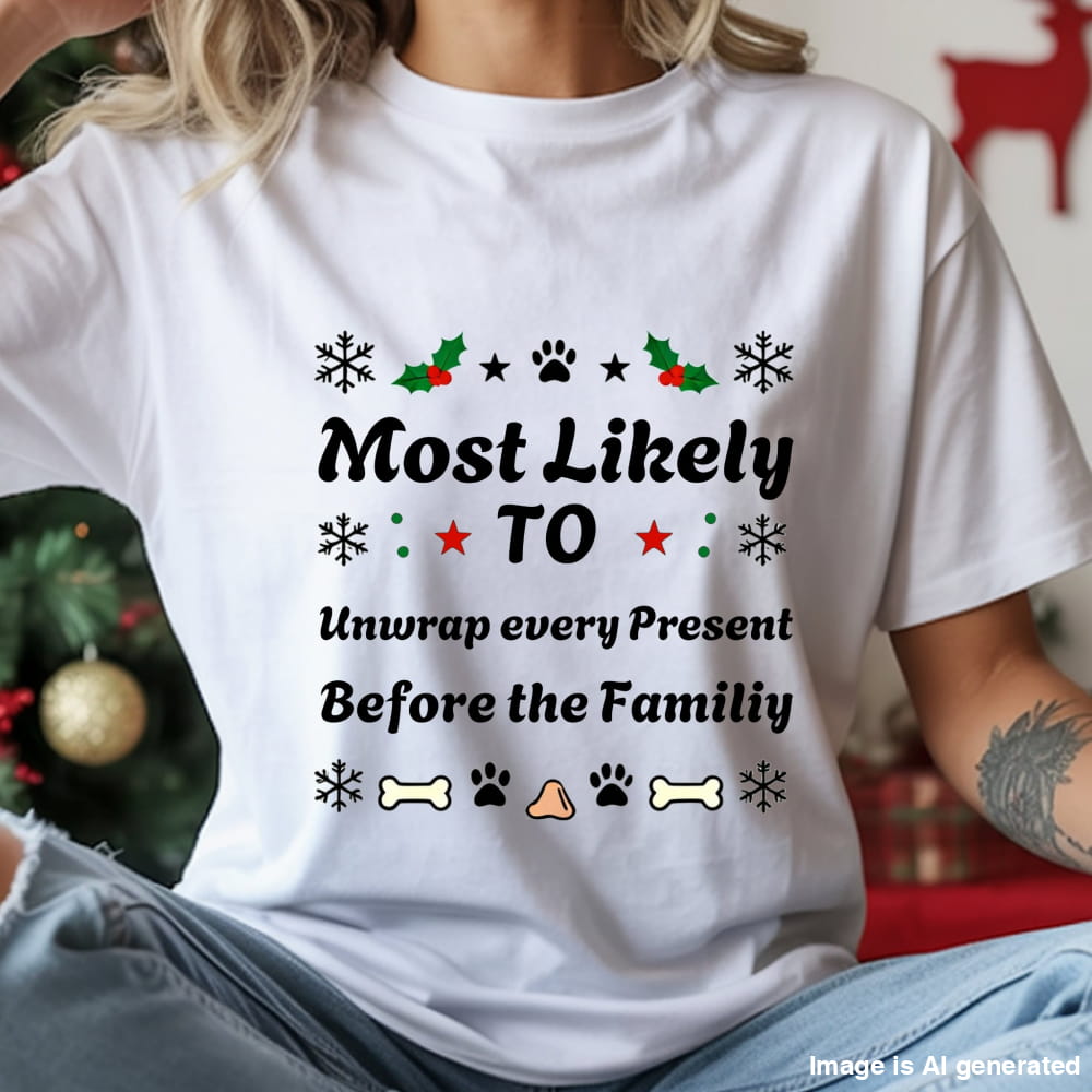 White t-shirt with Christmas-themed text and graphics worn by a person, with a blurred background.