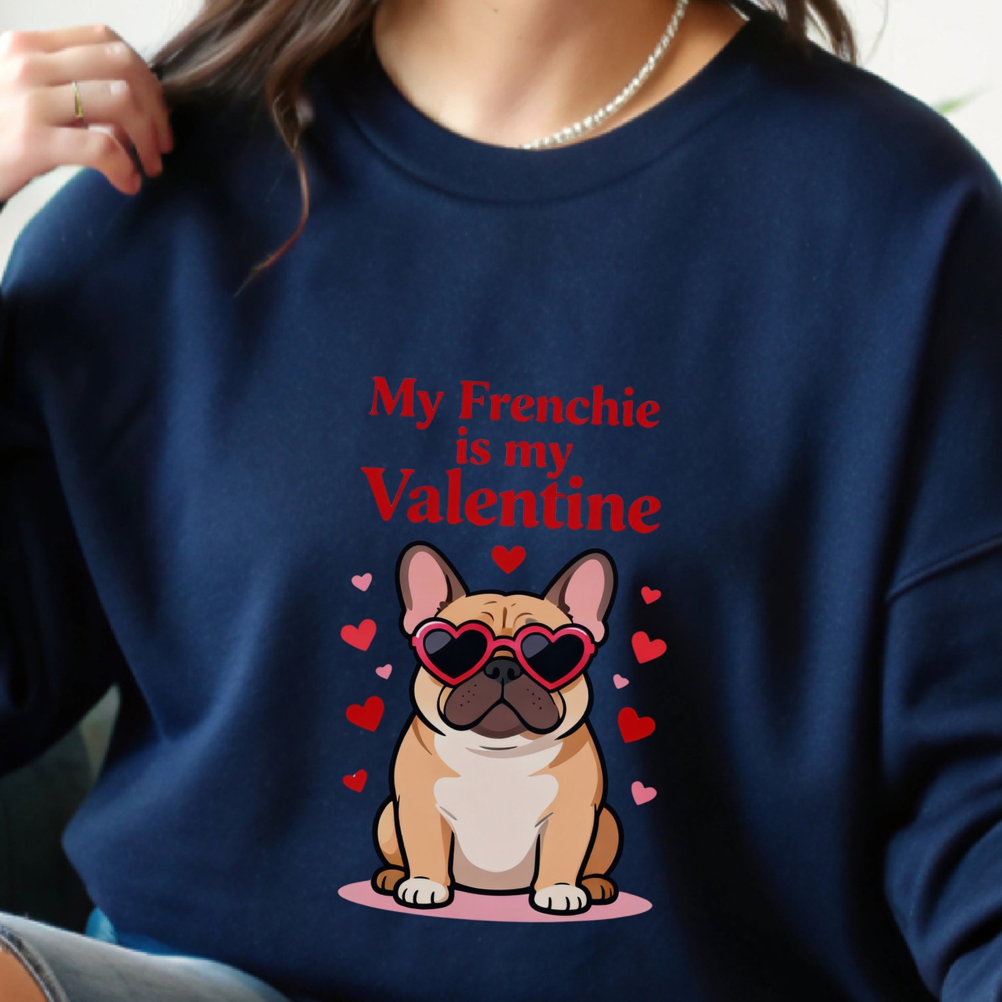 Navy blue sweatshirt with a cartoon French Bulldog and text 'My Frenchie is my Valentine' on a blurred background.