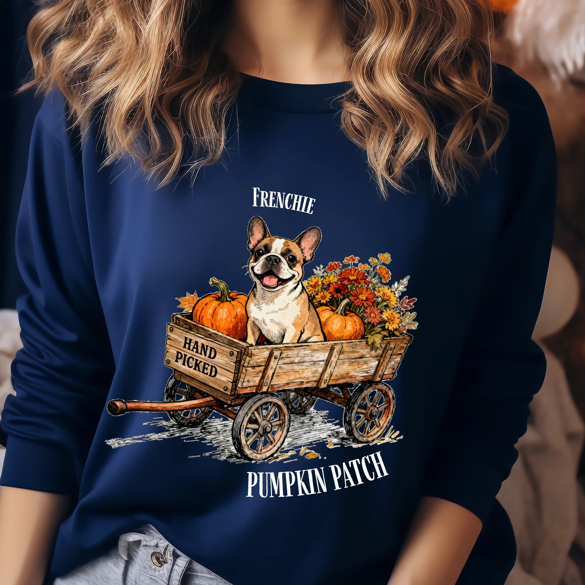 Navy blue sweatshirt with a dog and pumpkin design, worn by a person.