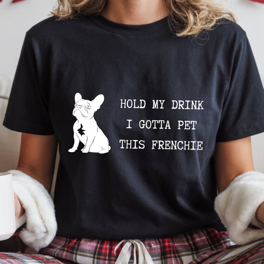 Person wearing a black t-shirt with a dog graphic and text.